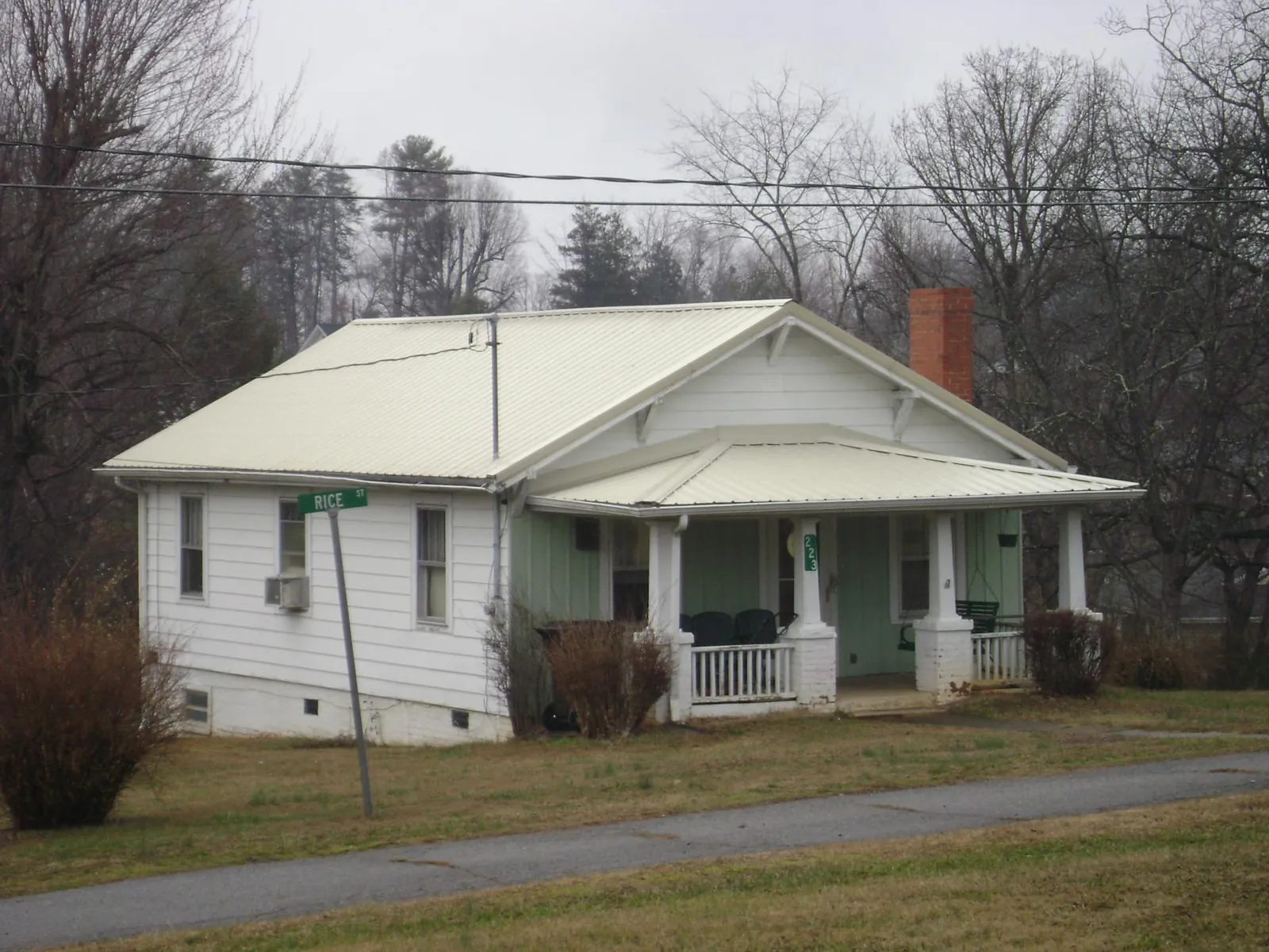 White metal roof on a craftsman bungalow at a street corner in Fairmont